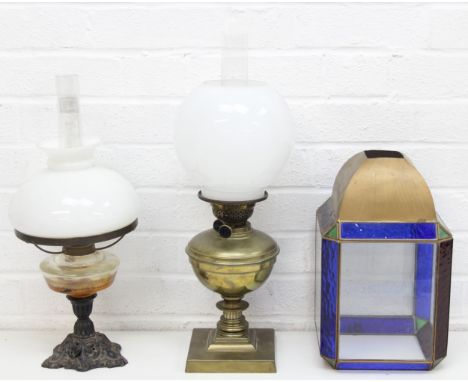 Three vintage lamp items to incl 2 oil lamps with chimneys and shades, one brass the other cast iron and glass, the largest 5