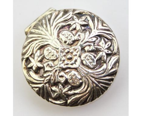 A silver pill box with embossed Art Nouveau floral decoration, import marks for Sheffield 1994 by Mark Houghton Ltd, 35mm in 