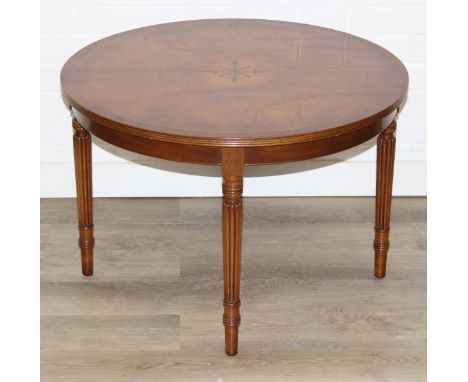 An antique style low round table with inlay and reeded legs, to match library table lot following, 76cm in diameter x 51cm ta