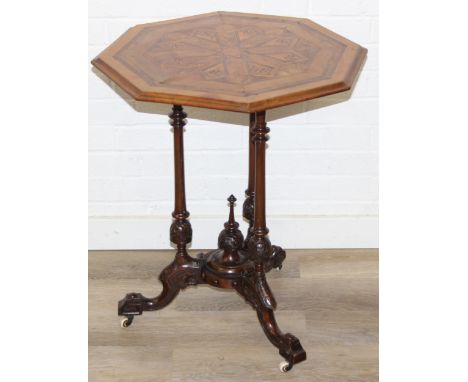 An antique specimen wood parquetry inlaid octagonal topped table with intricately carved triple pillar base, splayed legs and