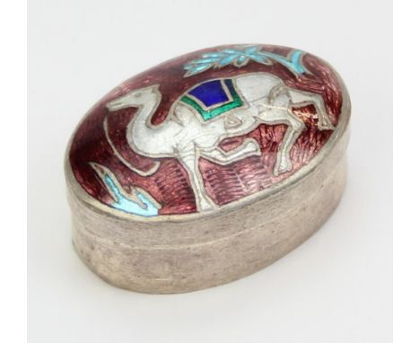 A small silver and enamel pill box decorated with a camel, possibly Indian, unmarked but XRF confirmed as at least 95% pure s