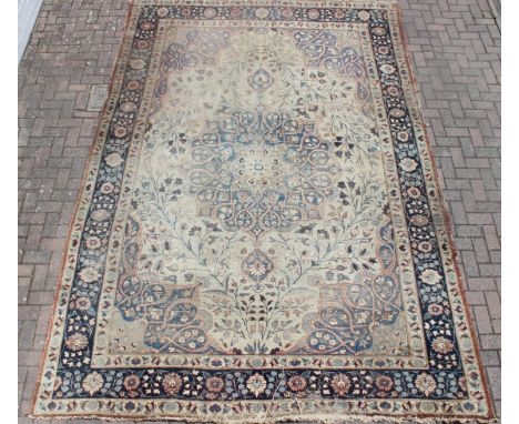 A large vintage Perisan rug, believed to be a Tabriz, blue ground with dark blue border, 380cm x 274cm