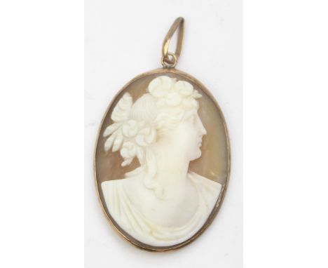 A vintage 9ct gold mounted shell cameo pendant depicting a classical female bust, seemingly unmarked but XRF confirmed as 9ct