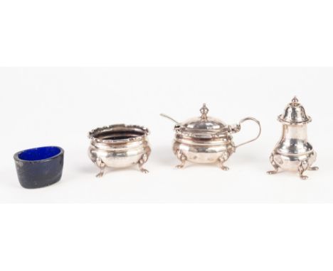A PRE-WAR SILVER THREE PIECE CONDIMENT SET of MUSTARD POT with blue glass liner, SALT CELLAR with inner and a PEPPERETTE, EAC
