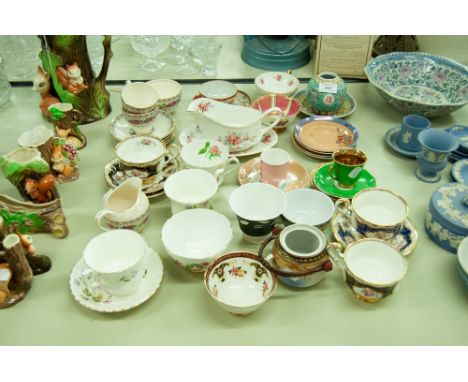 A SELECTION OF CUPS AND SAUCERS, OTHER ORIENTAL ITEMS, A MILK JUG AND STAND ETC..... 