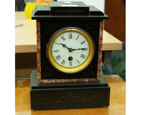 A SMALL BLACK SLATE MANTEL CLOCK 