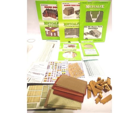 Selection of building kits including Metcalfe engine shed, farm buildings and Railway Modeller free kits, transfers, walling,