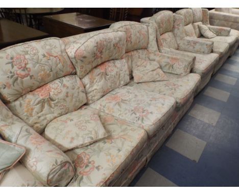 A Patterned Four Piece Suite Comprising Three Seater and Two Seater Settee, Armchair and Pouffe 