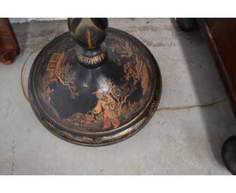A late 19th or early 20th Century ebonised and chinoiserie detailed standard lamp