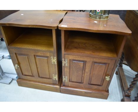 A pair of vintage/modern stained frame bedside cabinets of large proportions