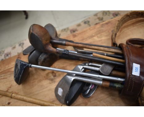 A selection of vintage golf clubs in early bag, includes William Perrins