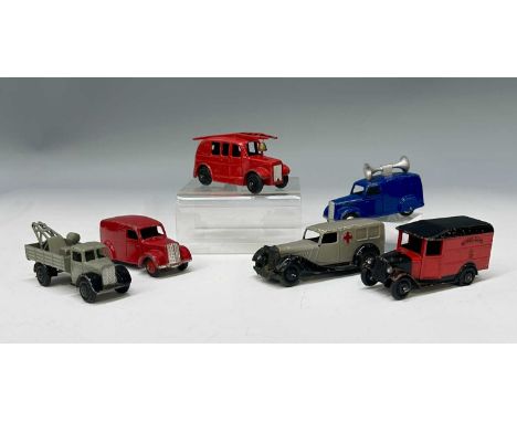 A collection of six Dinky Toys utility vehicles: a Streamlined Fire Engine 250, bright red with silver details and a ringing 