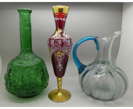 An Italian gilded and enamel glass vase, a zodiac glass bottle and a hand blown 19th Century glass jug, height of red vase 25