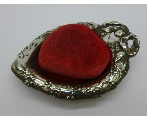 A sterling heart shaped pin cushion, marked Reed & Barton