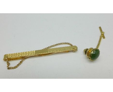 A 9ct gold back and front tie-pin and a tie clip/stud with jade stone, both boxed