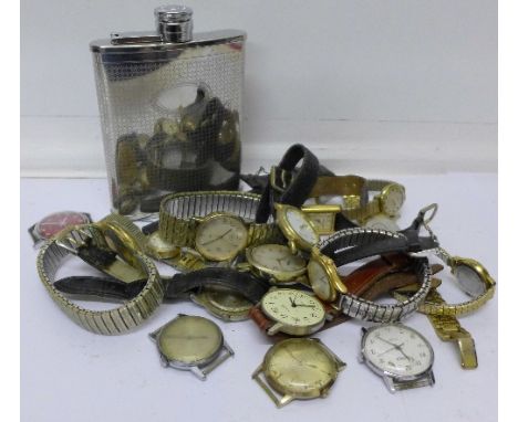 A collection of wristwatches including Rotary and Timex and a hip flask