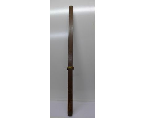 A military issue surveying instrument with spirit level, marked Parsons, no. 1040, 1942, and D broad arrow D, length 126cm