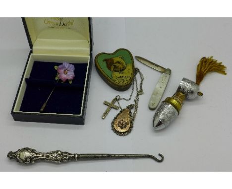 A silver handled button hook, a silver and mother of pearl fruit knife, a needle and thread case, silver pendant, etc.