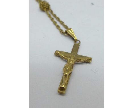 A 9ct gold crucifix and chain, 2.8g