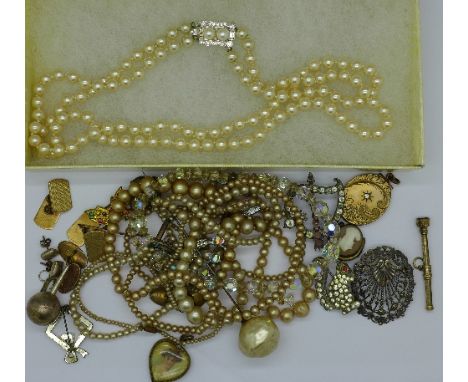 A collection of jewellery including silver, faux pearl necklaces, etc.