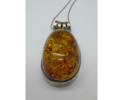 A silver and Baltic amber pendant and chain