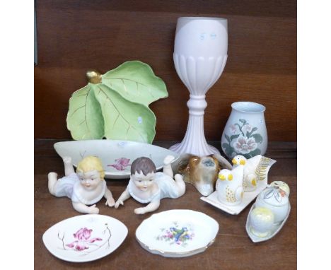 Eleven items of china including a pair of piano babies, Carltonware, Beswick, Weatherby, Bing and Grondahl, etc.