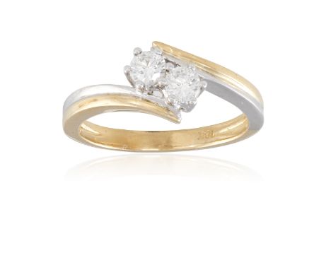 A DIAMOND DRESS RING, set with two brilliant-cut diamonds to a plain bi-coloured 18K gold hoop, ring size K½