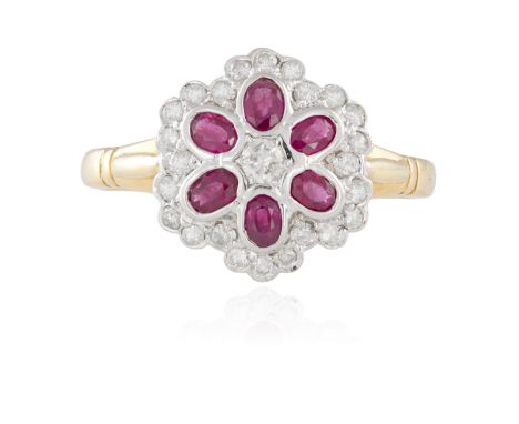 A RUBY AND DIAMOND DRESS RING, composed of oval-shaped rubies within a surround of circular-cut diamonds, mounted in 18K gold