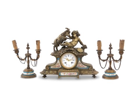 A FRENCH GILT METAL AND PORCELAIN MOUNTED THREE PIECE CLOCK GARNITURE, 19th century, comprising a clock and figural candlesti