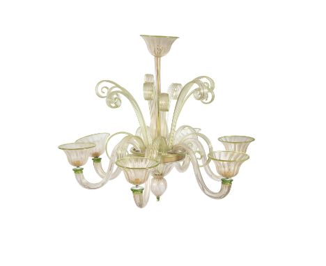 A VENETIAN BLOWN GLASS SIX LIGHT CHANDELIER, the reeded baluster column with vase shaped base supporting the scroll branches,