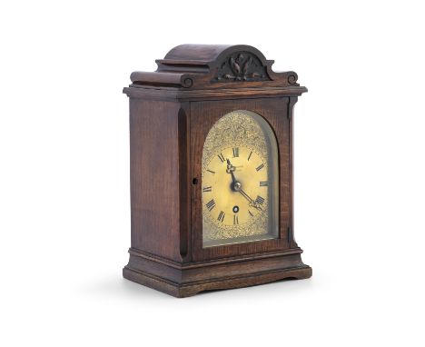 A MID 19TH CENTURY OAK CASED MANTLE CLOCK, by J. W Benson, Ludgate Hill, London, the arched rectangular case with floral carv