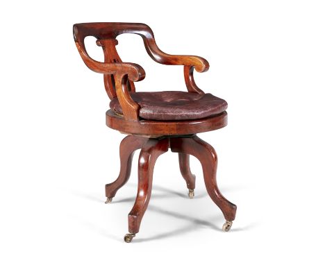 A VICTORIAN MAHOGANY AND BUTTON UPHOLSTERED SWIVEL CHAIR, c.1840, with pierced vase shaped splat and down curved armrests, th