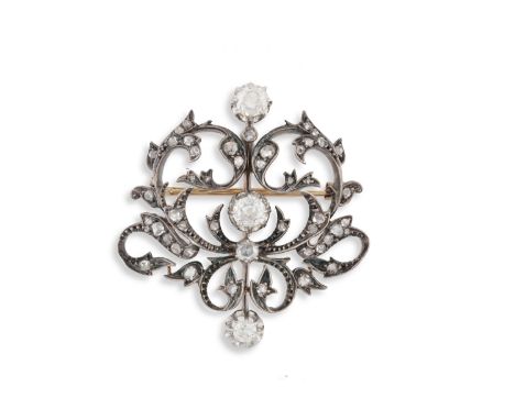 A LATE 19TH CENTURY DIAMOND BROOCHOf openwork scrolling design, set throughout with old cushion and rose-cut diamonds, mounte