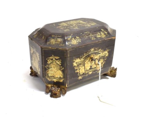 A CHINESE EXPORT PAPIER MACHE TEA CADDY  of octagonal form with gilt decoration, rasied on lion mask feet, pair of metal cani