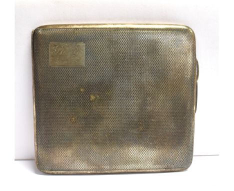 A SILVER CIGARETTE CASE  of engine tuned pattern, the corner cartouche inscribed Bunty 20.11.39, gilt interior, elastic prese