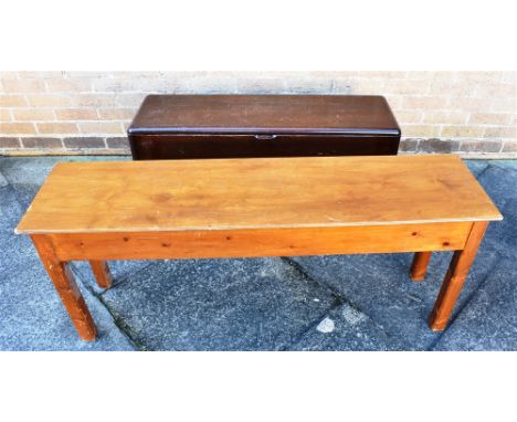 AN EDWARDIAN MAHOGANY DUET STOOL  99cm wide 31cm deep 36cm high; together with another pine bench with ply top, 123cm long 30