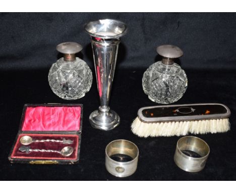 A COLLECTION OF SILVER Weighted silver candlestick, height 16.5cm, two silver topped cut glass perfume bottles with glass sto