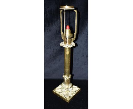 A VICTORIAN BRASS SPRING LOADED CANDLE LAMP  stamped 'PALMER &amp; CO PATENT', wiht foliate cast base, 54cm high overall Cond