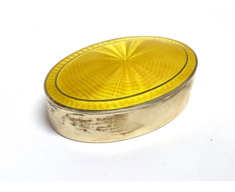 SILVER AND GUILLOCHE ENAMEL TRINKET BOX The oval trinket box fitted with a yellow sunburst Guilloche enamel lid, make M N W B