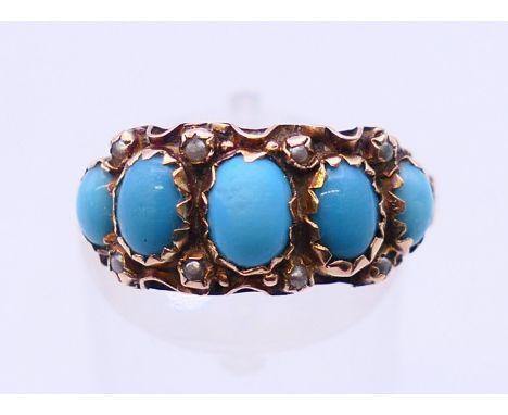A 9 ct gold, seed pearl and turquoise ring, hallmarked for Birmingham 1909.  Ring size P/Q.