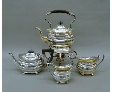 A matched four-piece silver tea service, hallmarked Chester 1905-1912. The kettle 32 cm high. 69.2 troy ounces total weight. 