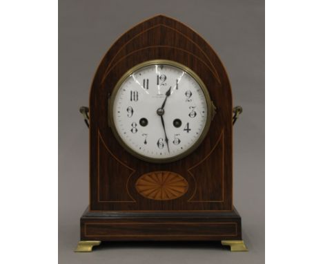 An Edwardian inlaid rosewood-cased mantle clock. 30 cm high.