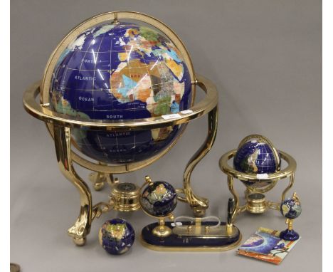 A modern gemstone globe and other various desk accoutrements. The former 49 cm high.