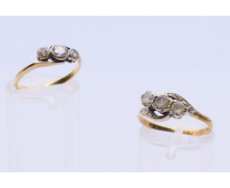 A 9 ct gold three stone ring and an unmarked yellow metal three stone ring.  9 ct gold ring size O, unmarked ring size K/L.