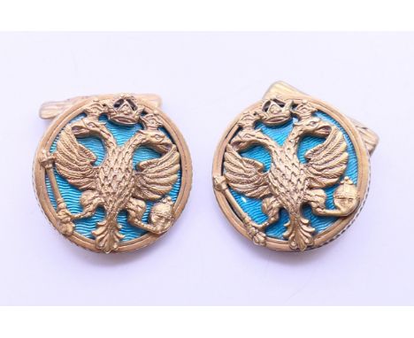 A pair of silver enamel cufflinks bearing Russian marks. Each 2.5 cm diameter.