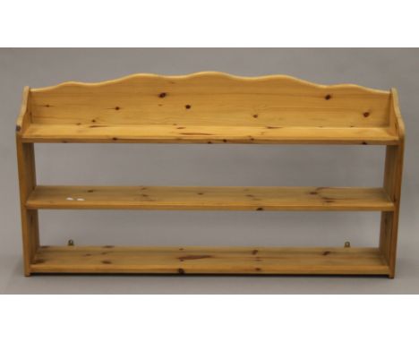 A modern pine wall shelf. 137 cm wide.