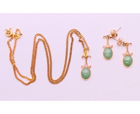 A 9 ct gold and jade pendant on a 9 ct gold chain, together with a matching pair of 9 ct gold and jade earrings. The pendant 