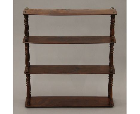 A Victorian mahogany wall shelf. 64 cm wide.