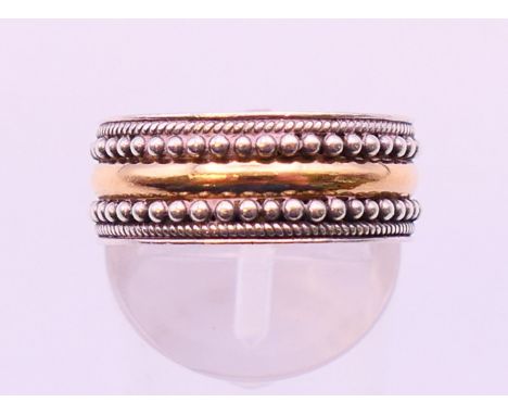 A Suarti silver and gold plated band ring, stamped 925 and 18 K.  Ring size N/O.