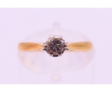 An 18 ct gold diamond solitaire ring. Ring size K. 2.5 grammes total weight.